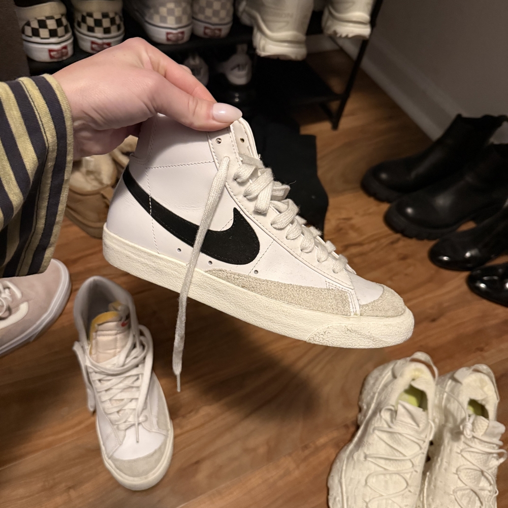 Nike White High-Top Sneakers with Black Swoosh